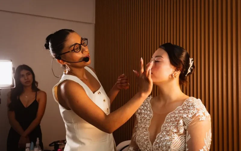 Bride receiving makeup in preparation for a wedding in Mexico City.