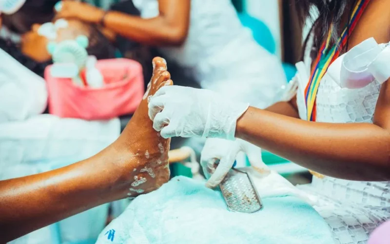 Close-up of a pedicure treatment being performed in a salon setting.